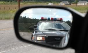 Cop-In-Rearview-Mirror.jpg